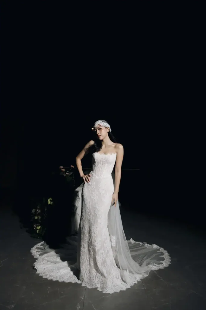 Ada strapless lace mermaid wedding gown with scalloped train and lace headpiece