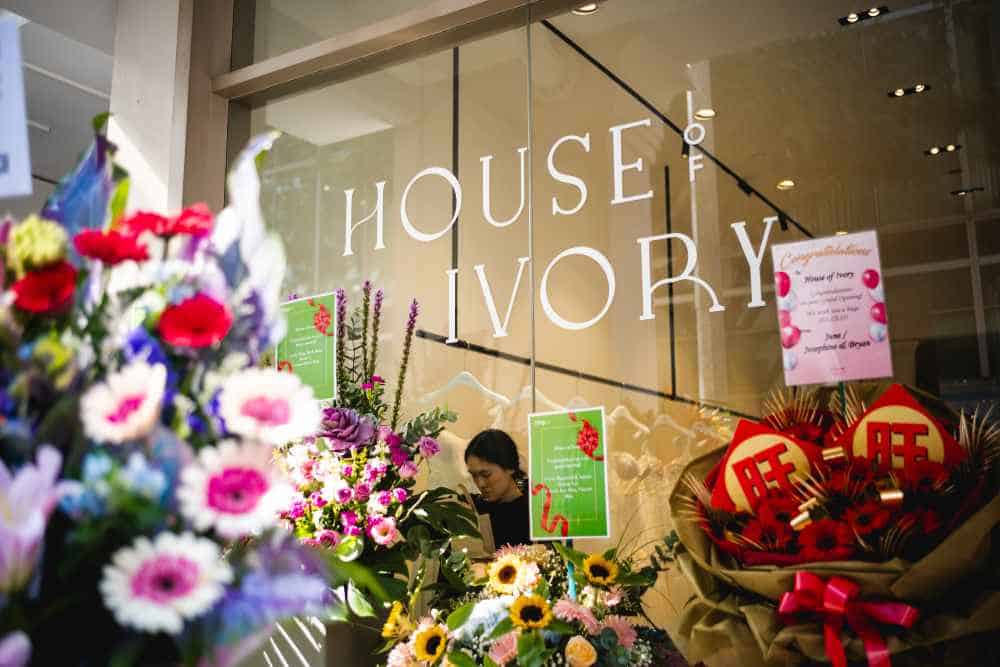 House of Ivory flagship shopfront in Singapore with grand opening flower stands