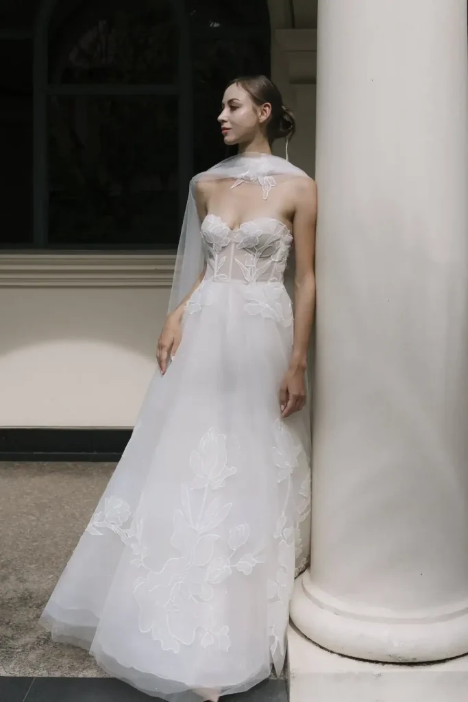 Josie strapless sheer corset A-line wedding gown with floral lace appliqué