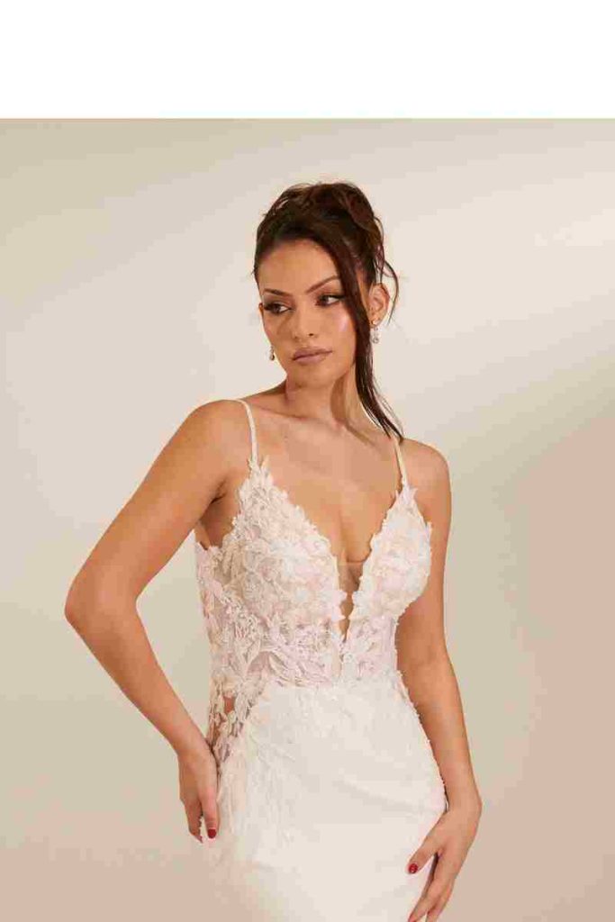 Beaded lace plunging V-neck wedding gown with thin straps by Zavana Bridal