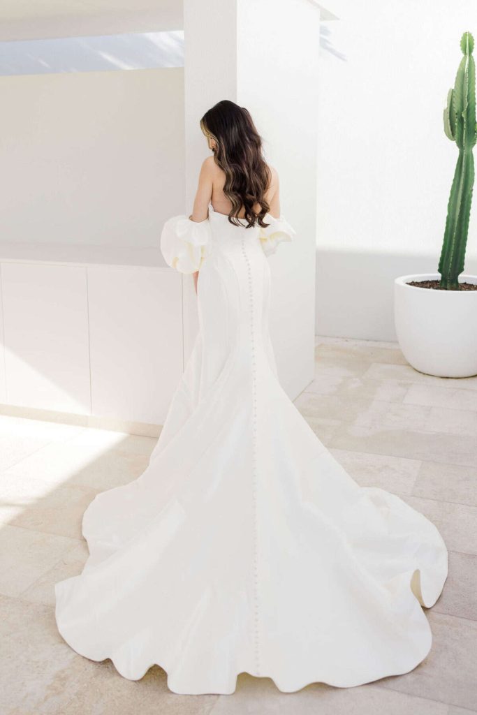 Strapless crepe mermaid wedding gown with covered button back by Zavana Couture