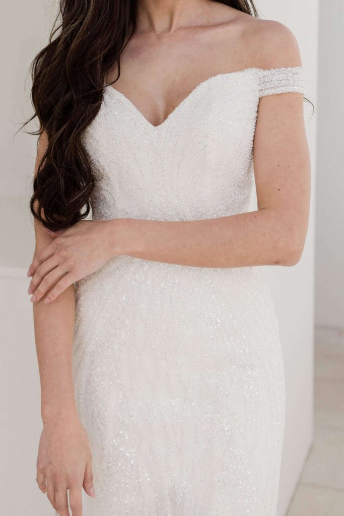 Off-the-shoulder sparkling sweetheart wedding dress by Zavana Couture
