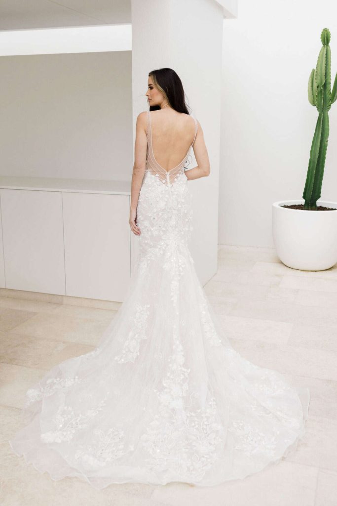Open-back floral lace mermaid wedding gown with sheer straps by Zavana Couture